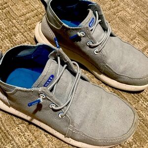 Reef slip on mid high shoes. Very comfortable.